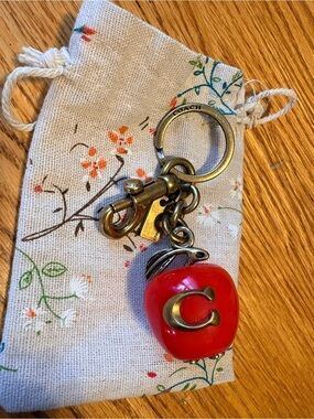 “Coach” Red Apple Charm Keyring with Brass 'C'